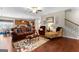 Inviting living room with hardwood floors, comfortable seating, and staircase access at 71 Pacific Ave, Sharpsburg, GA 30277