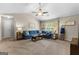 Cozy living room area featuring a vaulted ceiling, fan, and natural light at 71 Pacific Ave, Sharpsburg, GA 30277