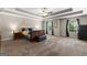 Spacious main bedroom with tray ceilings, carpeted floors, and natural light at 71 Pacific Ave, Sharpsburg, GA 30277