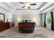 Spacious main bedroom features tray ceilings, ceiling fan and large window providing ample natural light at 71 Pacific Ave, Sharpsburg, GA 30277