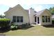 A home featuring a well-maintained backyard with a patio and ample green space at 300 Cloverwood Dr, Fayetteville, GA 30215