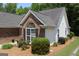 A well-maintained home featuring lush landscaping and a blend of brick and siding at 300 Cloverwood Dr, Fayetteville, GA 30215