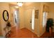 Bright foyer featuring hardwood floors, elegant decor, and natural light at 300 Cloverwood Dr, Fayetteville, GA 30215
