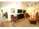 Bright living room offering an open floor plan with neutral decor, wood floors and ample seating at 300 Cloverwood Dr, Fayetteville, GA 30215
