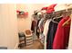 Organized walk-in closet with ample hanging space and shelving for storage at 300 Cloverwood Dr, Fayetteville, GA 30215