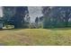 Expansive backyard with mature trees providing shade, perfect for outdoor activities and relaxation at 1102 Tony Valley Se Dr, Conyers, GA 30013