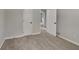 Spacious bedroom showcasing neutral carpeting and a closet, freshly painted in a light neutral color at 1102 Tony Valley Se Dr, Conyers, GA 30013