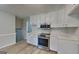 Modern kitchen with stainless steel appliances, white cabinetry, and updated countertops at 1102 Tony Valley Se Dr, Conyers, GA 30013