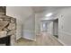 Living area with a stone fireplace, fresh paint, and modern wood-look flooring at 1102 Tony Valley Se Dr, Conyers, GA 30013