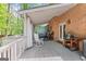 Outdoor deck with a covered area, ideal for grilling, dining, and relaxing in a backyard setting at 145 Oxford Ln, Fayetteville, GA 30215