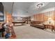 Finished basement with carpet, wood paneling, and large billiards table for entertainment at 145 Oxford Ln, Fayetteville, GA 30215