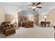 Bedroom featuring vaulted ceiling, ceiling fan, a bed and a sitting area at 145 Oxford Ln, Fayetteville, GA 30215