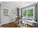 Inviting dining area with a bay window and a gray accent wall at 145 Oxford Ln, Fayetteville, GA 30215