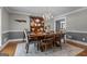Cozy dining room featuring hardwood floors, a rustic table, and a decorative hutch at 145 Oxford Ln, Fayetteville, GA 30215
