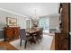 Charming dining room featuring a wooden table, chandelier lighting, and traditional furnishings at 145 Oxford Ln, Fayetteville, GA 30215