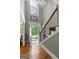 Grand foyer with an open view of the staircase and entryway, featuring hardwood floors and plenty of natural light at 145 Oxford Ln, Fayetteville, GA 30215