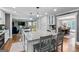 Bright and airy kitchen with an island and stainless steel dishwasher at 145 Oxford Ln, Fayetteville, GA 30215