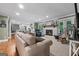 Spacious living room with a fireplace and an open view into the kitchen at 145 Oxford Ln, Fayetteville, GA 30215