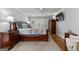 Bright main bedroom with hardwood floors, a ceiling fan, and a decorative armoire at 145 Oxford Ln, Fayetteville, GA 30215