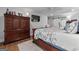 Spacious main bedroom with hardwood floors, a ceiling fan, and a modern sliding barn door at 145 Oxford Ln, Fayetteville, GA 30215