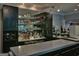 Elegant home bar featuring mirrored cabinets and ample counter space at 205 Somerset Ct, Mcdonough, GA 30253
