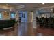 Finished basement with hardwood floors, a bar area, and comfortable seating at 205 Somerset Ct, Mcdonough, GA 30253