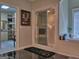 Bathroom with a glass shower, a soaking tub and access to a large closet at 205 Somerset Ct, Mcdonough, GA 30253