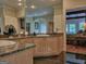 This bathroom vanity features double sinks, granite countertops and a tile floor at 205 Somerset Ct, Mcdonough, GA 30253