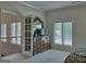 Spacious bedroom includes access to a staircase and a large dresser with a mirror at 205 Somerset Ct, Mcdonough, GA 30253