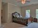 Cozy bedroom boasts an ornate bed and large windows for natural light at 205 Somerset Ct, Mcdonough, GA 30253