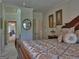 Bedroom featuring a large bed with decorative pillows and artwork, providing a serene retreat at 205 Somerset Ct, Mcdonough, GA 30253