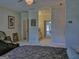 Lovely bedroom includes access to multiple rooms and a ceiling fan with a chandelier at 205 Somerset Ct, Mcdonough, GA 30253
