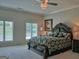 This bedroom features natural light and a beautifully decorated, ornate bed at 205 Somerset Ct, Mcdonough, GA 30253