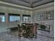 Stylish dining room with a unique table, mirrored accents, statement lighting, and elegant finishes at 205 Somerset Ct, Mcdonough, GA 30253