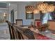 Dining room with decorative furnishings and lighting, open to the living room at 205 Somerset Ct, Mcdonough, GA 30253