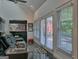 This living room has a vaulted ceiling, a black marble floor and a view of the outside at 205 Somerset Ct, Mcdonough, GA 30253