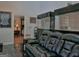 Living room features a large black leather couch and 2 large fish tanks built into the wall at 205 Somerset Ct, Mcdonough, GA 30253