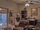 Cozy home office featuring a leather armchair, ceiling fan, and curated art collection at 205 Somerset Ct, Mcdonough, GA 30253