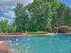 Close up view of a beautiful pool with spa at 205 Somerset Ct, Mcdonough, GA 30253