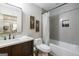 Modern bathroom featuring gray subway tile, a shower-tub combination, and a dark-wood vanity at 111 S Old 27, Roopville, GA 30170