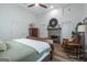 Bedroom featuring a brick fireplace, wooden floors, neutral walls, and a ceiling fan at 111 S Old 27, Roopville, GA 30170