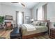 Spacious bedroom with wood floors, stylish decor, and ample natural light creating a welcoming ambiance at 111 S Old 27, Roopville, GA 30170