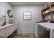 Functional laundry room featuring modern appliances, decorative touches, and ample counter space at 111 S Old 27, Roopville, GA 30170