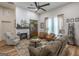 Cozy living room featuring a fireplace, hardwood floors, and ample seating, creating a warm and inviting space at 111 S Old 27, Roopville, GA 30170