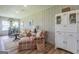 Cozy living room featuring a casual dining area, comfortable seating, and bright, natural light at 111 S Old 27, Roopville, GA 30170
