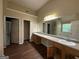 The bathroom has a double vanity, shower and separate tub at 257 Juliet Dr, Hampton, GA 30228