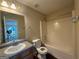 Bathroom with single sink vanity and shower/tub combo at 257 Juliet Dr, Hampton, GA 30228