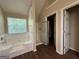 The bathroom has a shower, separate tub and window at 257 Juliet Dr, Hampton, GA 30228