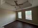 Bedroom with hardwood floors, trey ceiling, ceiling fan and two windows at 257 Juliet Dr, Hampton, GA 30228