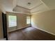 Bedroom with hardwood floors, trey ceiling and window at 257 Juliet Dr, Hampton, GA 30228